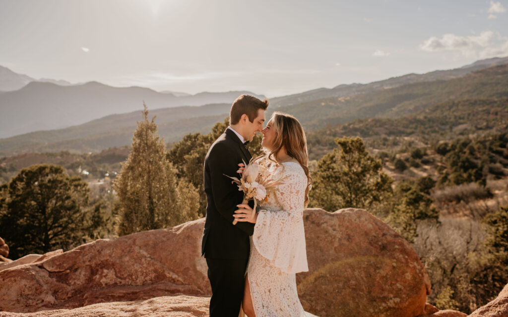 Bride and groom in front of Pikes Peak at Garden of the Gods