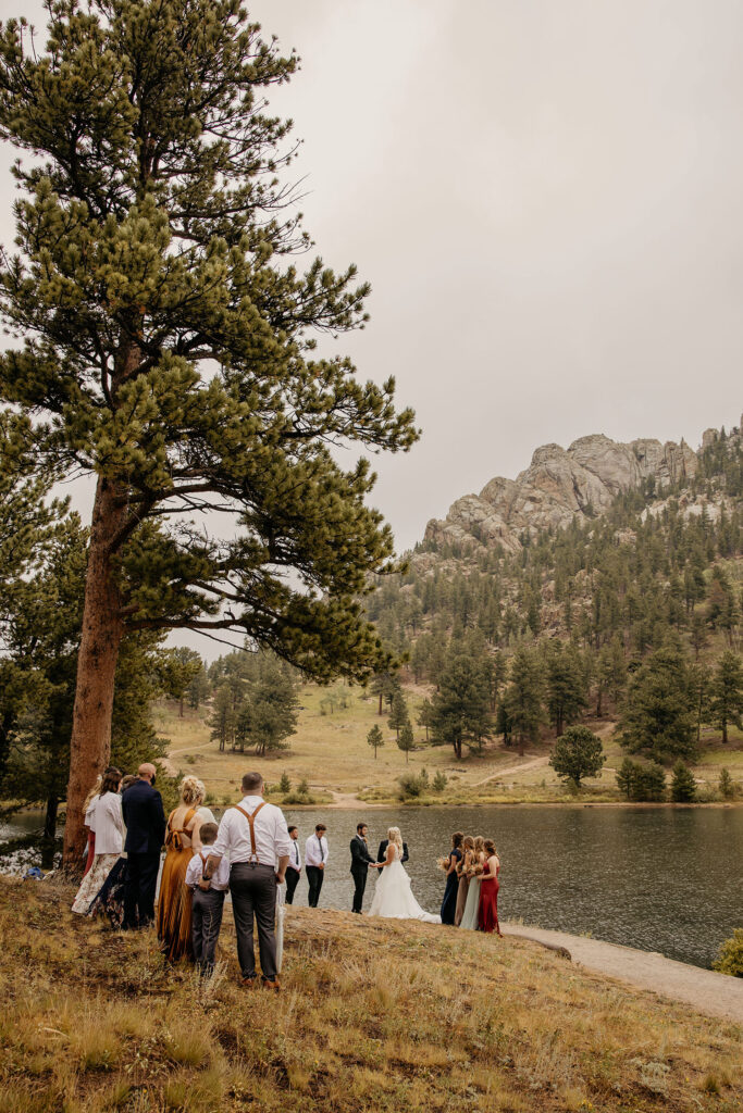 Wide shot of wedding and guests at elopement at Lily Lake.
