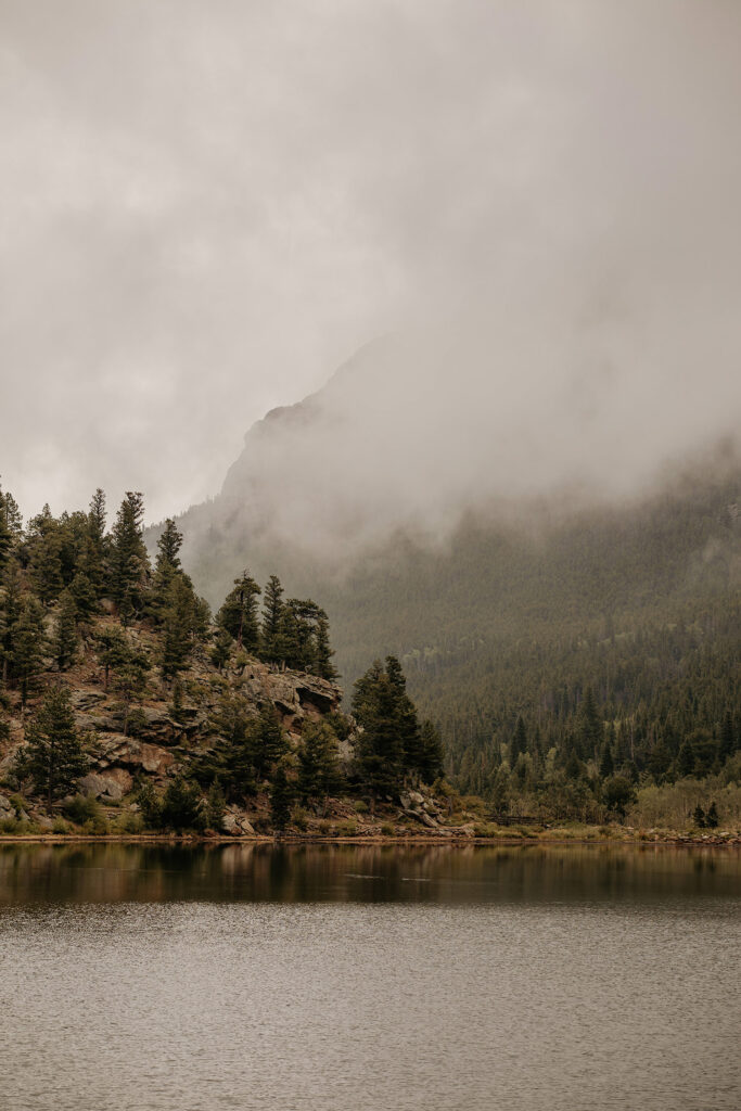 Fog rolling over mountains at Lily Lake.