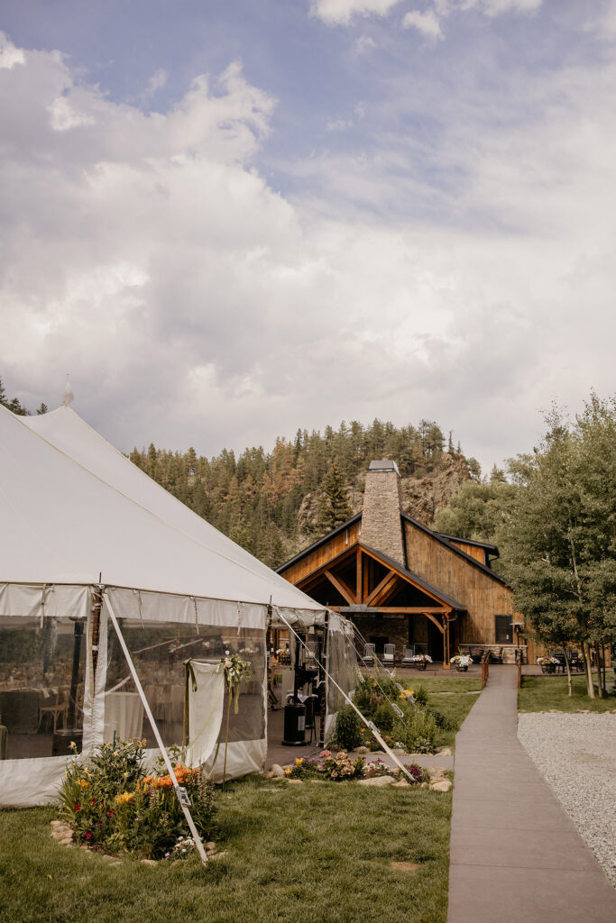 Venue shot of sailcloth tent used for receptions and large cabin at Blackstone Rivers Ranch.