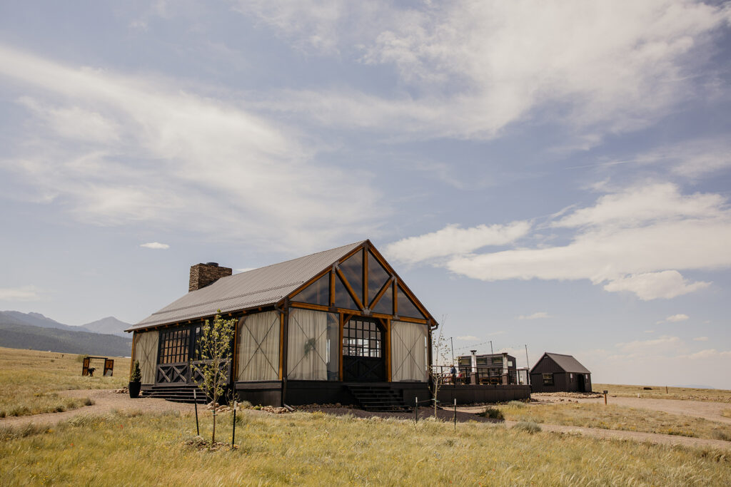 Three Peaks Ranch Wedding Venue showcasing "The Pavilion," a glass greenhouse with a western feel.